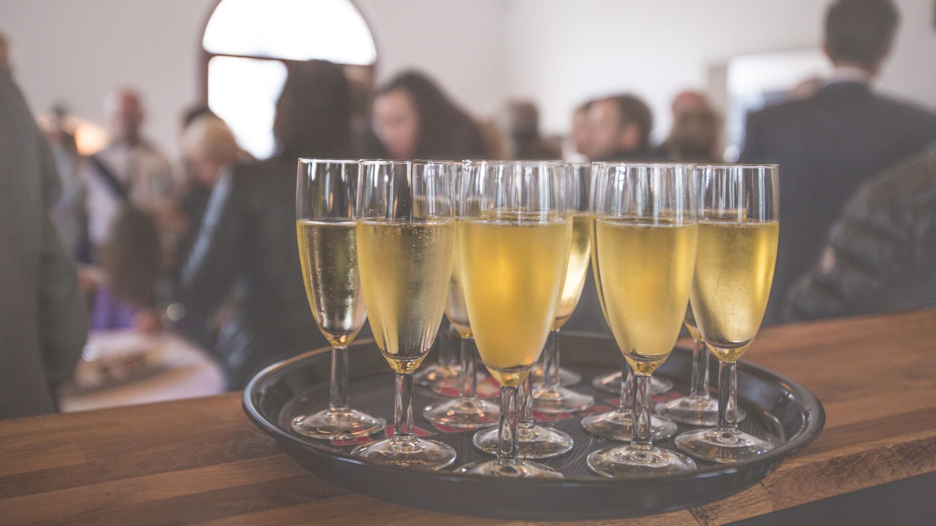 cider in glasses on tray sitting at event